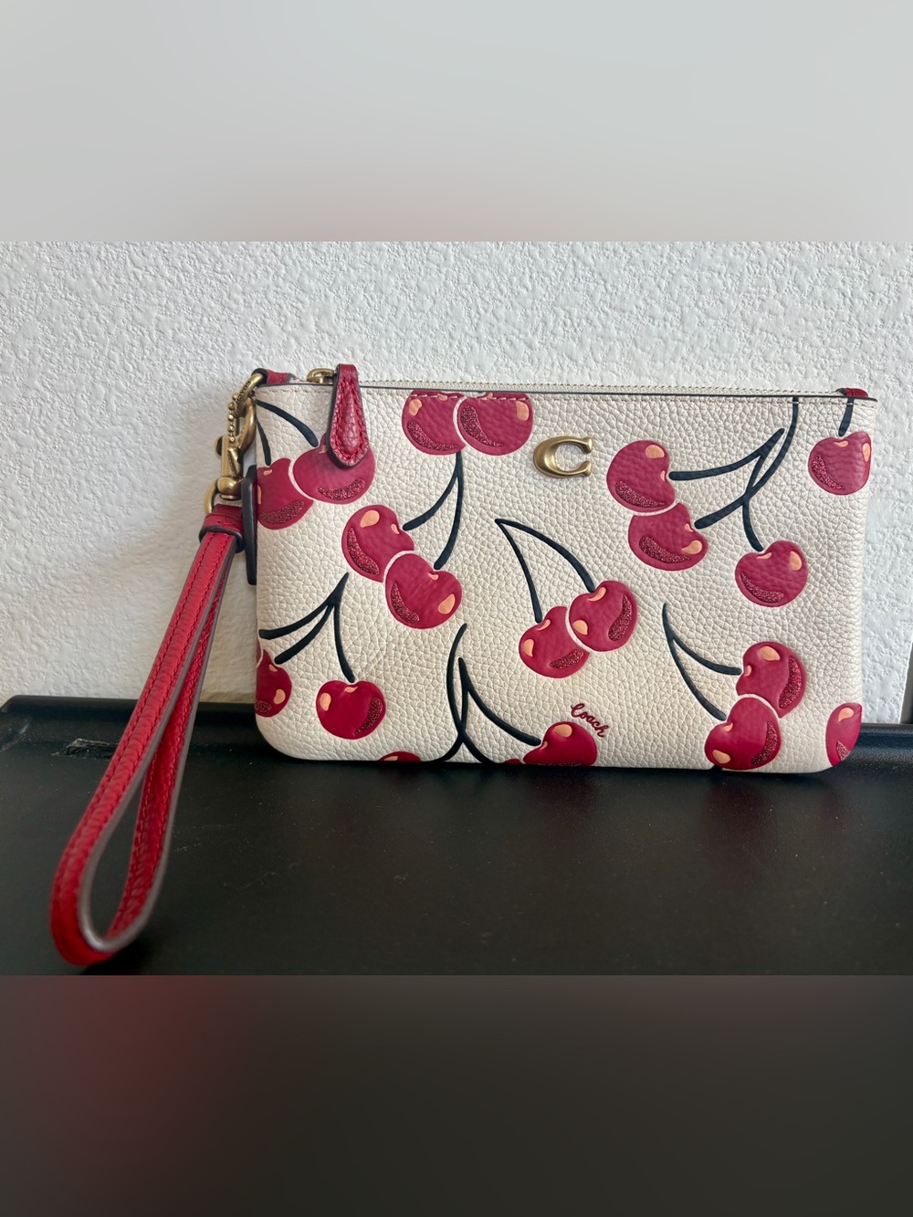 Coach Cherry print wristlet